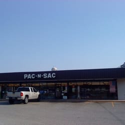 Sac-N-Pac - Pac-N-Sac storefront, with the iconic Buda water tower behind it.