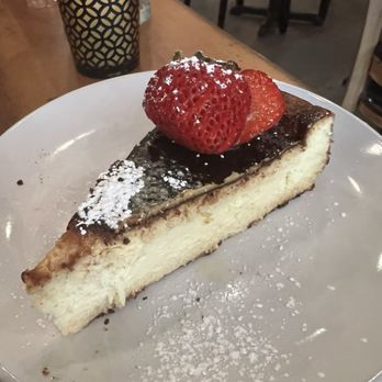 El Mercat Bar De Tapas - San Sebastián (Basque "burnt") Cheesecake - nice and creamy, but tasted like a drizzle of olive oil on top? - Tapas Bars Near Me - Rockville, Maryland