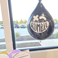 Rumble Boxing - Punching bag in lobby with local business setup