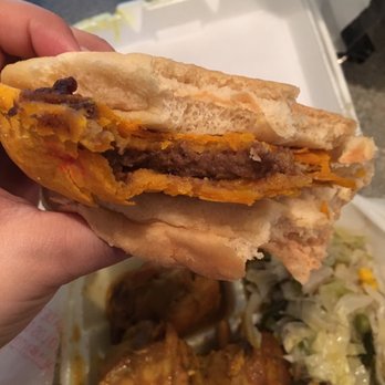 Caribbean Hut - Beef pattie and cocobread .. everything was so good forgot to take a pic before biting into it lol - Caribbean Near Me - Charlotte, North Carolina Caribbean Hut - Beef pattie and cocobread .. everything was so good forgot to take a pic before biting into it lol - Caribbean Near Me - Charlotte, North Carolina
