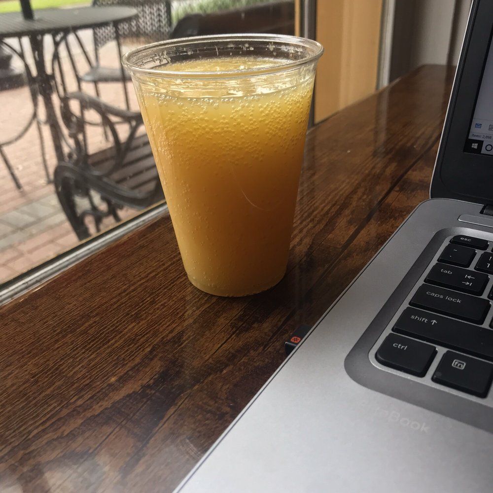 Cafe Lucia - When you have been at the same coffee shop for 6 hours, you order a mimosa. They were low on wine glasses so I told him plastic was fine - Coffee Roasteries Near Me - Smyrna, Georgia