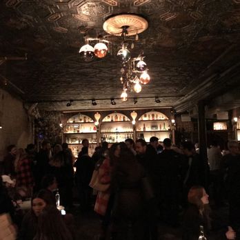 Apotheke - a crowd of people in a dimly lit room - Cocktail Bars Near Me - New York, New York