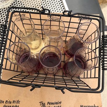 Casa Dumetz Wines - four glasses of wine in a wire basket - Wine Tours Near Me - Los Alamos, California