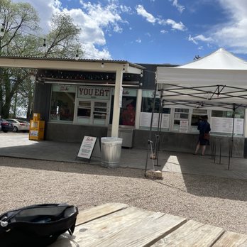 Shake Foundation - the outside of a building with tables and chairs - Burgers Near Me - Santa Fe, New Mexico