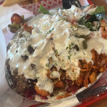 Halal House - Combo build your plate with half rice half salad half chicken and half gyro with green sauce Tahini and white sauce - Mediterranean Near Me - Northridge, California
