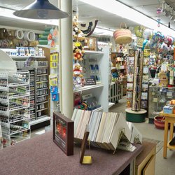 SGMC-Solanco Glass & Mirror - This view from our custom framing counter shows some of our acrylic paints along with our selection of scribbles paint.