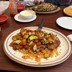 Casa Real Mexican Restaurant - Pollo Yucatán, chess's dip and in the background, Steak Fajitas.
