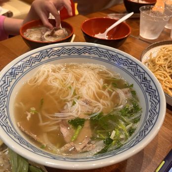 District 9 Kitchen - A comforting bowl of noodle soup with tender beef, fresh herbs, and a flavorful broth. - Noodles Near Me - Anaheim, California District 9 Kitchen - A comforting bowl of noodle soup with tender beef, fresh herbs, and a flavorful broth. - Noodles Near Me - Anaheim, California