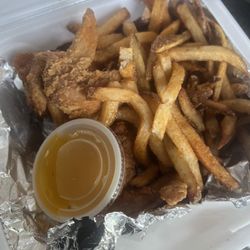 Warehouse Fish & Chicken - 3 pc Wings/Fries with garlic Parmesan sauce. Don't let the photo fool ya. It's 3 wings under a mound of fries. A lot of yummy food for $5