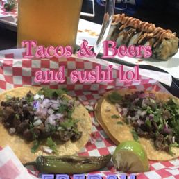 Asada tacos , tempura roll, and modelo with lemon and Tajin. Asada tacos , tempura roll, and modelo with lemon and Tajin.