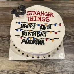 a birthday cake with the words stranger things on it