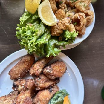 Old Settler Pub - Top: crispy calamari; Bottom: salt & pepper wings - properly cooked! - Pubs Near Me - Harrison Hot Springs, British Columbia Old Settler Pub - Top: crispy calamari; Bottom: salt & pepper wings - properly cooked! - Pubs Near Me - Harrison Hot Springs, British Columbia