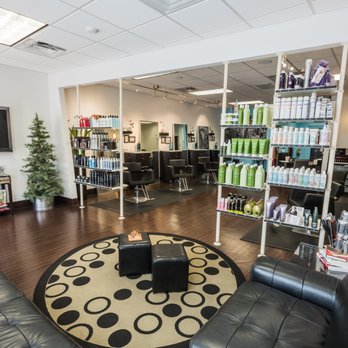 Salon Wow - Product display with salon beyond - Hair Salons Near Me - Ocala, Florida Salon Wow - Product display with salon beyond - Hair Salons Near Me - Ocala, Florida