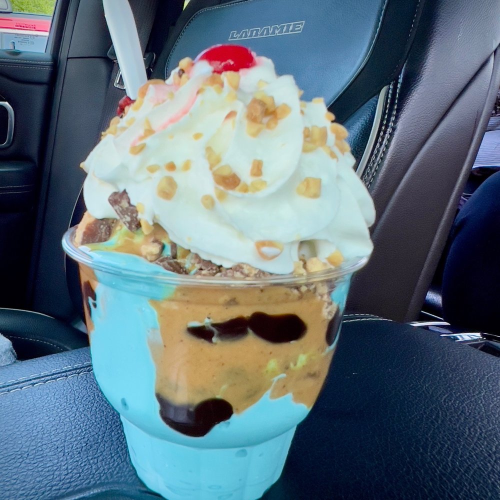 Twin Scoops - Reese's peanut butter cup sundae with blue raspberry ice cream. - Ice Cream & Frozen Yogurt Near Me - Hudson Falls, New York Twin Scoops - Reese's peanut butter cup sundae with blue raspberry ice cream. - Ice Cream & Frozen Yogurt Near Me - Hudson Falls, New York