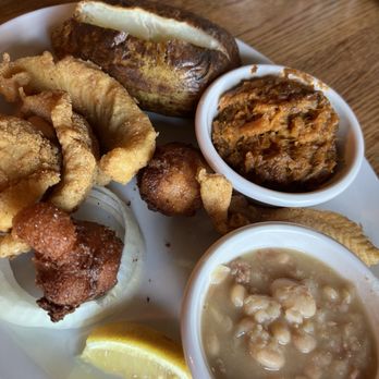 The Log Cabin - Fish plate with white beans, hash, puppies, baked potato, and sweet potato - American Near Me - Hurricane Mills, Tennessee The Log Cabin - Fish plate with white beans, hash, puppies, baked potato, and sweet potato - American Near Me - Hurricane Mills, Tennessee