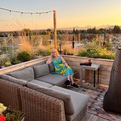 SCP Redmond Hotel - Rooftop dining with Cascade Range in distance