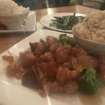 M Vista - Orange Chicken with white rice (in the back) and Orange Chicken with vegetable fried rice (front) - Asian Fusion Near Me - Columbia, South Carolina