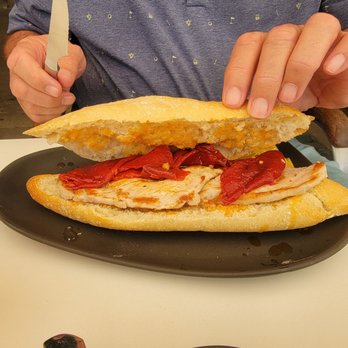 Café Iruña - Pork loin and red peppers - Spanish Near Me - Pamplona, NA Café Iruña - Pork loin and red peppers - Spanish Near Me - Pamplona, NA