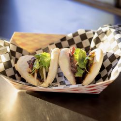 Coronado Smokehaus BBQ - Our A1 Bao starts with soft bao buns and slow-smoked beef cheeks that eat like mini briskets, finished with house pickled onions, A1 sauce,