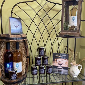 Blue Heron Winery - a shelf with bottles of wine, honey, and other items - Wineries Near Me - Pitt Meadows, British Columbia