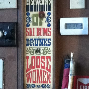 Marko's Place - a sign that reads beware of ski bums, drinks and loose women - Pubs Near Me - Roslyn, Washington
