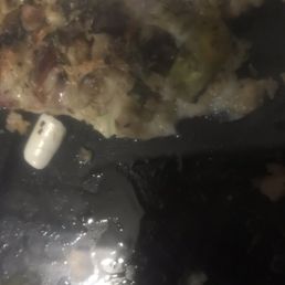a piece of pizza on a plate a piece of pizza on a plate