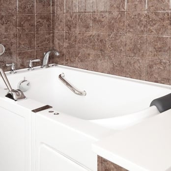 Re-Bath - a white bathtub in a tiled bathroom - Kitchen & Bath Near Me - Wilmington, North Carolina Re-Bath - a white bathtub in a tiled bathroom - Kitchen & Bath Near Me - Wilmington, North Carolina