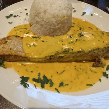 Harlemite Peruvian Cuisine - Salmon with saffron sauce with rice. - Peruvian Near Me - New York, New York