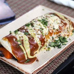 Rainbow Restaurant - Sweet Potato Burrito ($16.75) - sweet potatoes, black beans, eggs, Hatch green chiles, jack cheese, smothered in red chili with vegan cilant