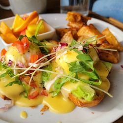 Avocado Benedict on croissant.
