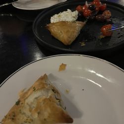 Spanakopita comes in 3 triangles with delicious tsatsiki sauce.