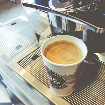 Corner Store - a cup of coffee on a coffee machine - Convenience Stores Near Me - Missouri City, Texas