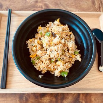 Little Tao - a bowl of fried rice with chopsticks - Szechuan Near Me - Boston, Massachusetts