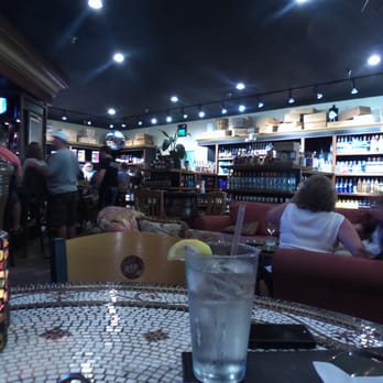 Liquid Assets - Our table, notice all the wine surrounding us on the walls - American Near Me - Ocean City, Maryland