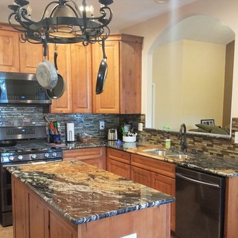 Pluma Construction - a kitchen with granite counter tops - Flooring Near Me - Albuquerque, New Mexico