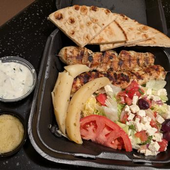 It's Greek to Us - Chicken Platter with Greek potatoes. Online pickup order. $24.95. Two chargrilled chicken kabobs, salad, pita, tzatziki. - Greek Near Me - Marietta, Georgia It's Greek to Us - Chicken Platter with Greek potatoes. Online pickup order. $24.95. Two chargrilled chicken kabobs, salad, pita, tzatziki. - Greek Near Me - Marietta, Georgia