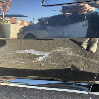 Fyxme - More of the dented car before FyxMe fixed it. - Mobile Dent Repair Near Me