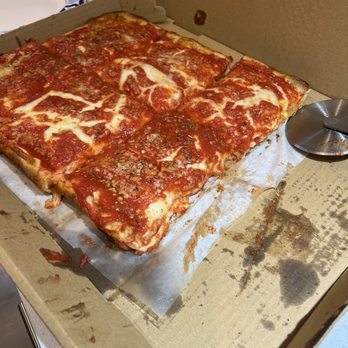 Fat Guy New York Style Pizza - Upside down pizza ordered well down.  First two slices already eaten before we took the photo, we couldn't wait to eat it. - Pizza Near Me - Davidson, North Carolina