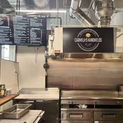 Carmela's handhelds stand located inside fresh market at Hershey on the first floor