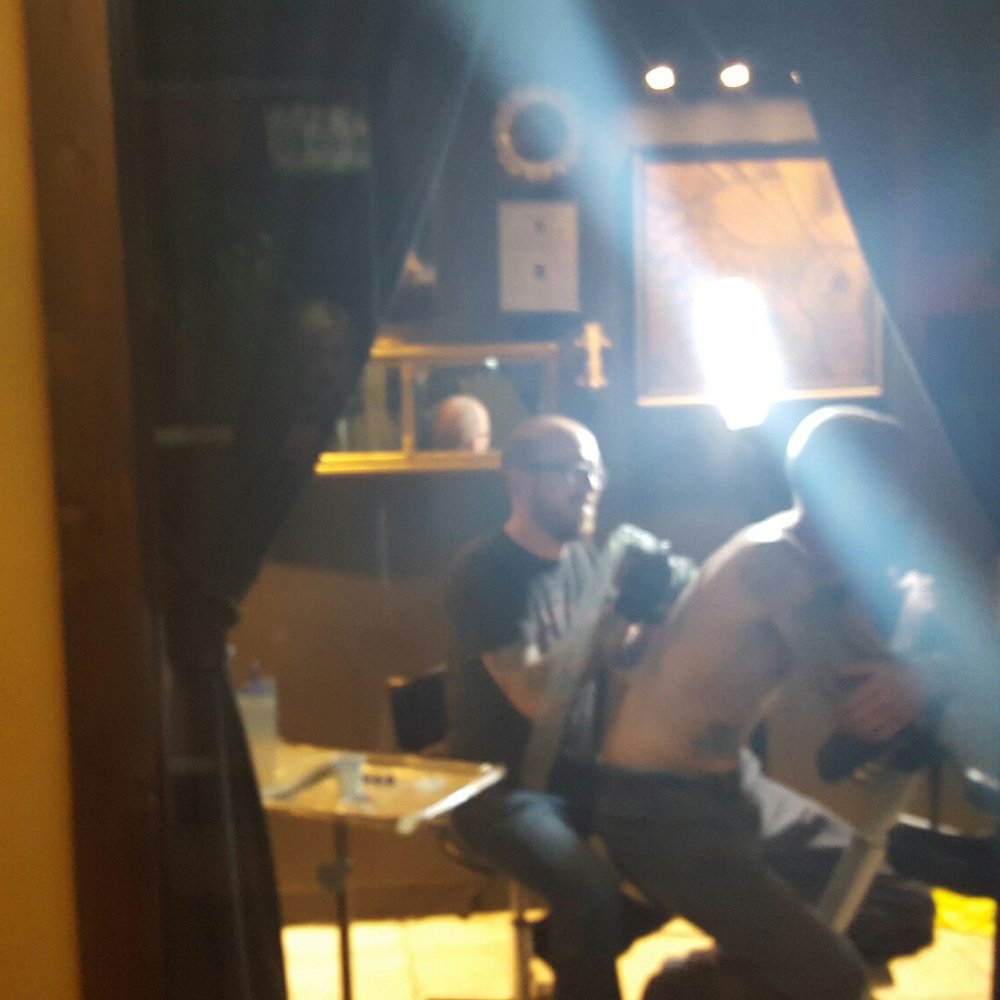 The Parlour - This was taken through a glass window, so cool to walk through the hallway and watch people getting tattooed! - Piercing Near Me - Buffalo, New York