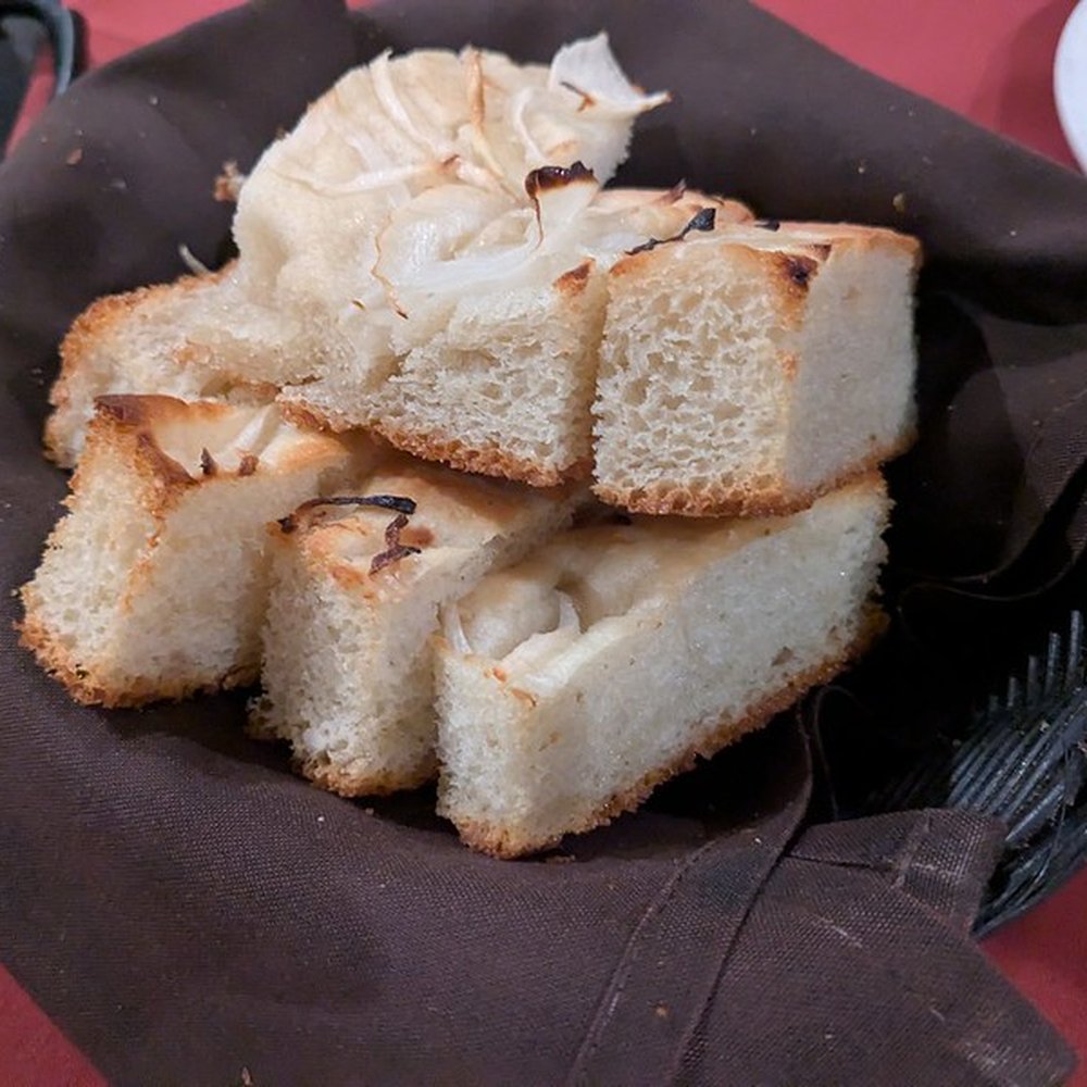 Barolo Cafe - Basket of homemade focaccia (minus the 2 pieces on our bread plates) - Italian Near Me - Tustin, California Barolo Cafe - Basket of homemade focaccia (minus the 2 pieces on our bread plates) - Italian Near Me - Tustin, California