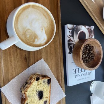 Dark Alchemy Coffee - Latte and slice of loaf bread - Breakfast & Brunch Near Me - Holly Hill, Florida
