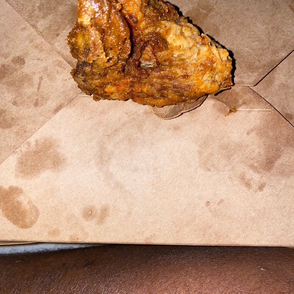Roots Chicken Shak - a piece of food on a piece of paper - Chicken Wings Near Me - Austin, Texas