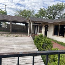 Los Magueyes Taqueria - Dilapidated patio and odd wooden stage