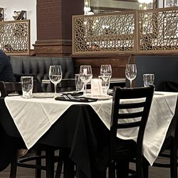 Maggiano's Little Italy - Beautifully set tables.