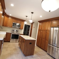 Gr8 Kitchens - Remodeled an old kitchen with new Wolf Designer cabinetry, porcelain tile floors, new stainless steel appliances, Cambria Qua...