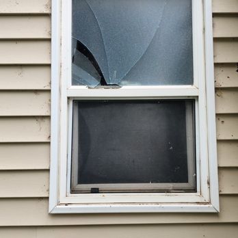 Champion Roofing - Broken bathroom window - Roofing Near Me
