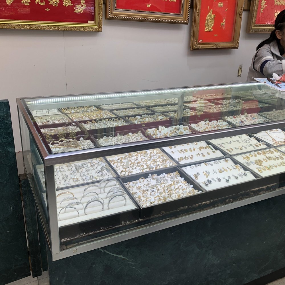 Phuong Jewelry - Some lady having pomegranate lunch at the display case lol. - Jewelry Near Me - Oakland, California