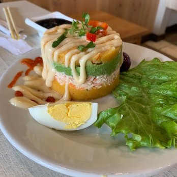 Kotosh - CAUSA RELLENA
Whipped potato with aji amarillo filled with imitation crab and avocado (spicy). - Sushi Bars Near Me - Lomita, California Kotosh - CAUSA RELLENA
Whipped potato with aji amarillo filled with imitation crab and avocado (spicy). - Sushi Bars Near Me - Lomita, California