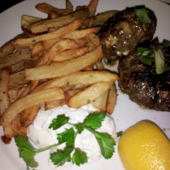 Yefsi Estiatorio - BIFTEKI - Greek Patties made with Certified Angus Beef with Onions, Kefalograviera, Cheese, Served with Greek Fries & Tzatziki. - Greek Near Me - New York, New York Yefsi Estiatorio - BIFTEKI - Greek Patties made with Certified Angus Beef with Onions, Kefalograviera, Cheese, Served with Greek Fries & Tzatziki. - Greek Near Me - New York, New York
